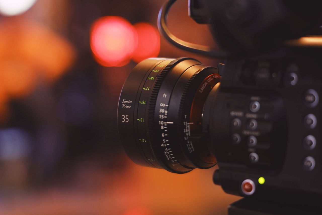 The Art of Drawing Readers In: Your attractive post title goes here Detailed close-up of a camera lens with blurred bokeh background, capturing modern photography equipment.