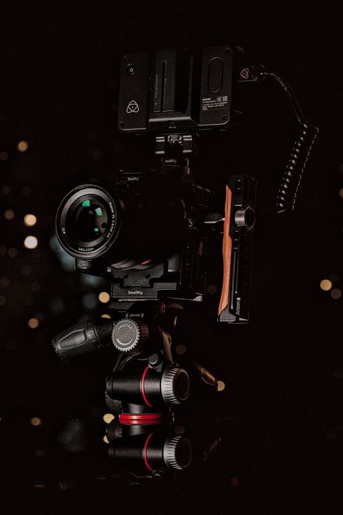 About Close-up shot of high-end video camera equipment with bokeh background, perfect for film or photography themes.